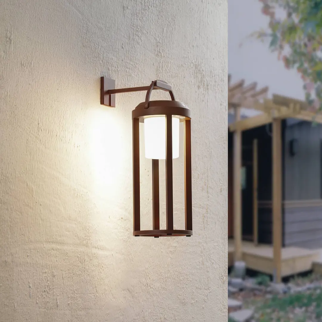 Lucande 2-in-1 LED-Solar-Wandleuchte Tilena, rost, rund, Alu