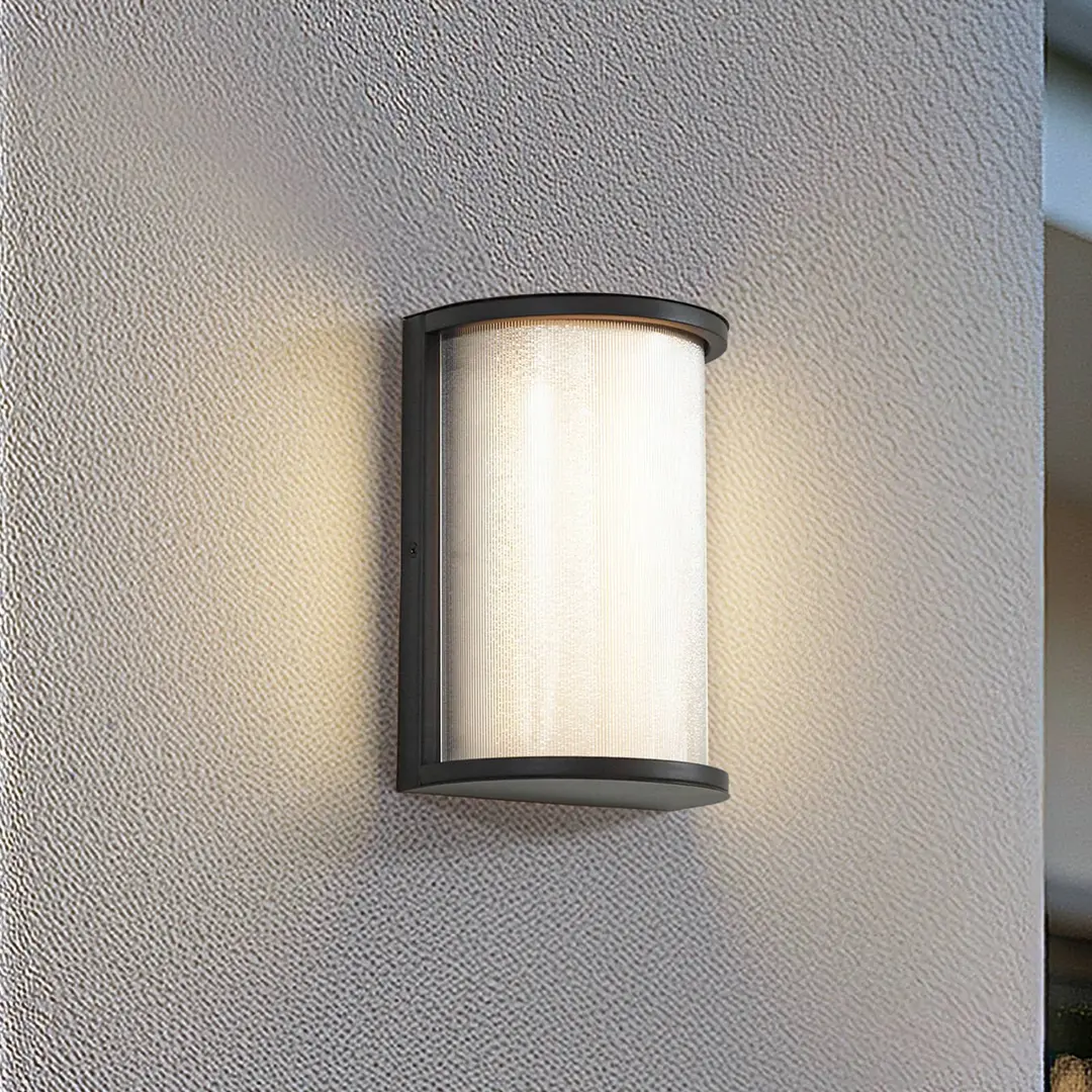 Lindby LED-Außenwandleuchte Calvik, schwarz, geriffelt, IP44